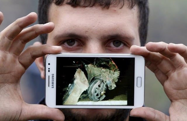 Осман из Сирии, с фотографией своей уничтоженной машины